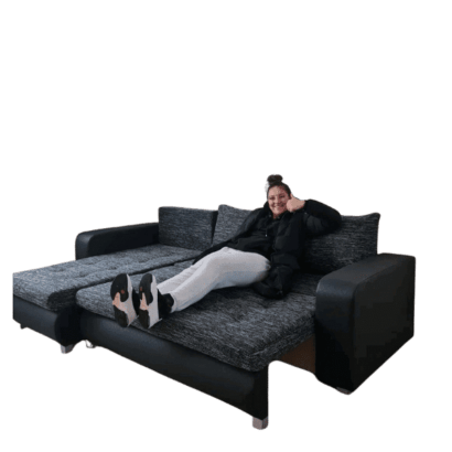 Berlin Sofa Bed Black with a lady sit on it By climax Furniture