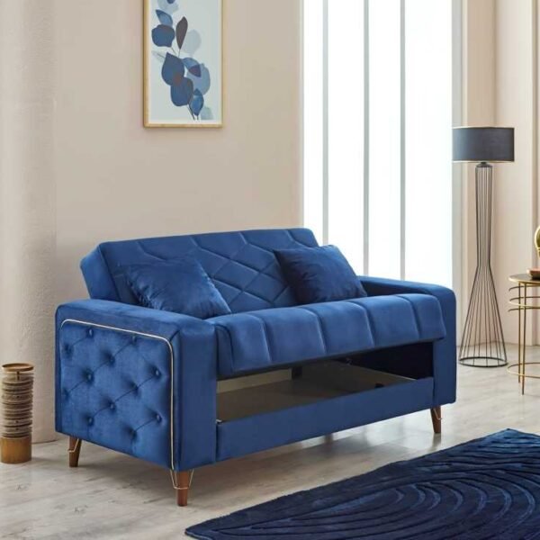 Modern blue velvet sofa bed with hidden storage in stylish UK living room