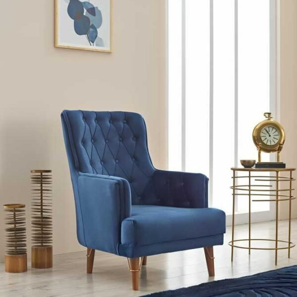 Melissa Sofa Bed | Ultimate Stylish & Functional UK-Made Blue velvet tufted armchair with wooden legs in a modern living room setting