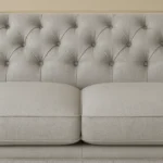 UK upholstered sofa with beige fabric, button-tufted backrest and cushioned seats