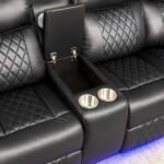 UK leather sofa console with storage and cup holders.