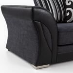 UK sofa arm detail with fabric and leather finish.