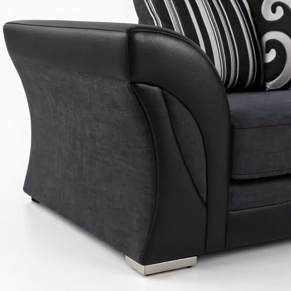 UK sofa arm detail with fabric and leather finish.
