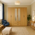 UK large Oak mirrored wardrobe with drawers in bedroom.