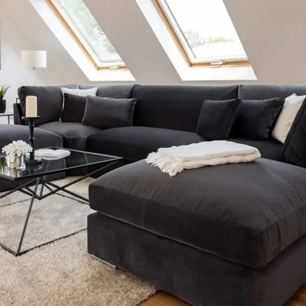 UK black corner sofa in modern living room.