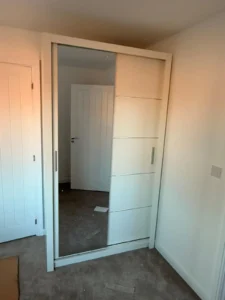 Climax Furniture Oslo Sliding Mirror Wardrobe 120cm in white, fitted in customer's bedroom