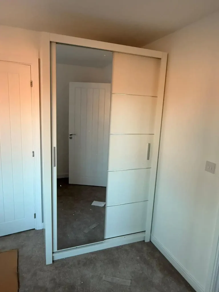Climax Furniture Oslo Sliding Mirror Wardrobe 120cm in white, fitted in customer's bedroom