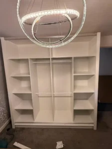 Climax Furniture Oslo Sliding Mirror Wardrobe 203cm internal shelving being installed in customer's home