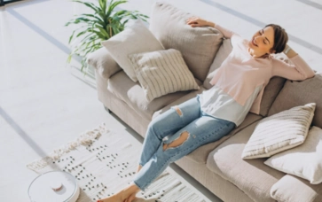 Girl relaxing on Soft velvet fabric 3-seater sofa - climax furniture